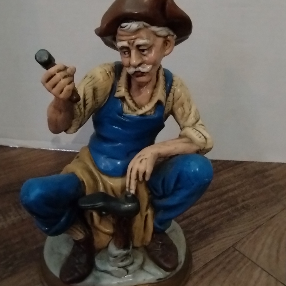 Old time figurine shoemaker